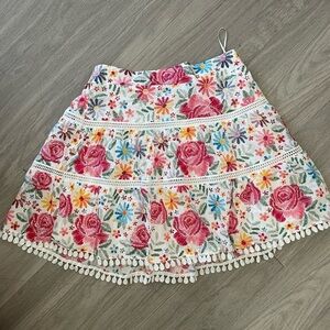 Moodie white pink and yellow colorful floral wild flower tiered mini skirt